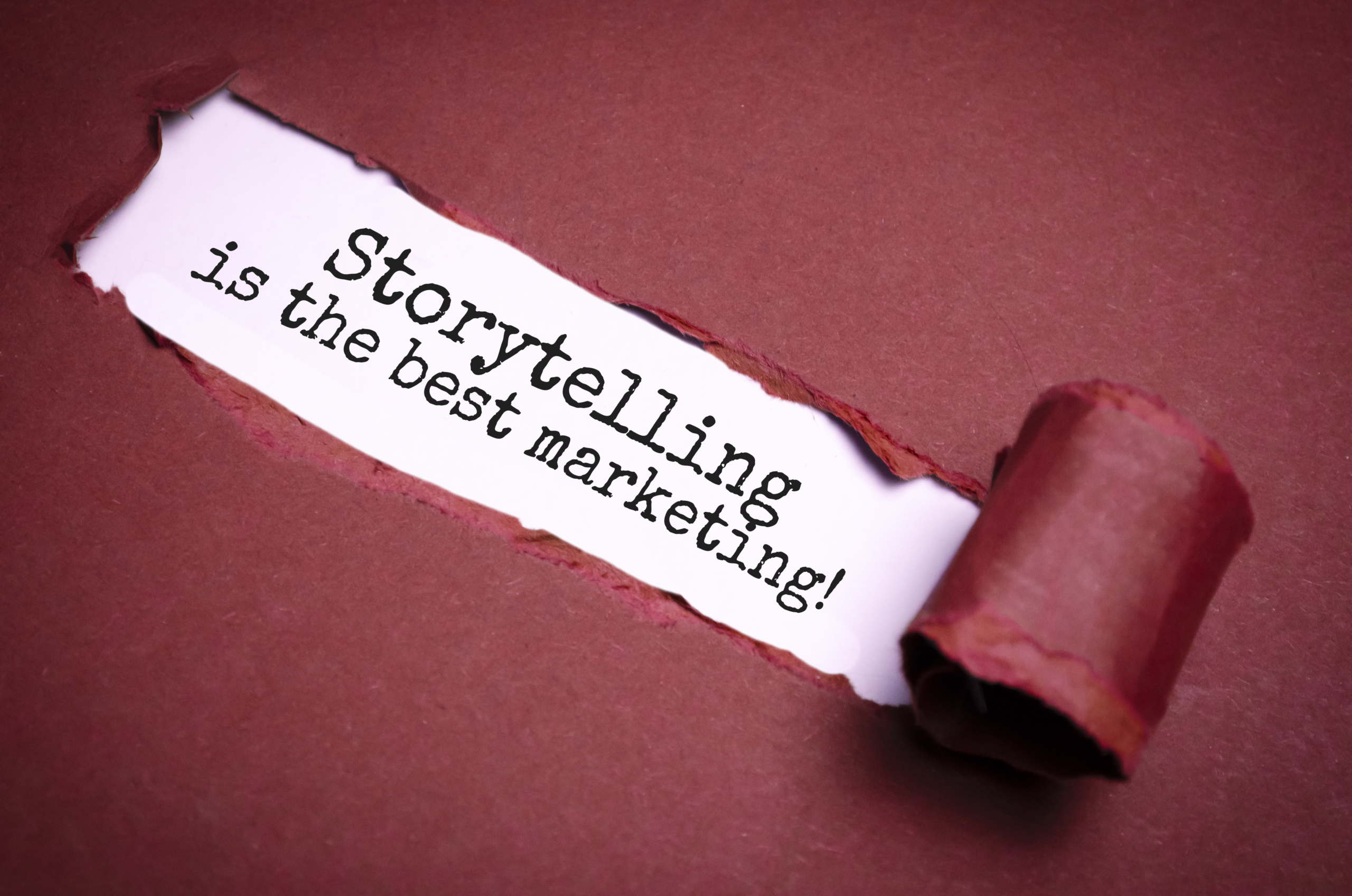 Storytelling is the best Marketing. Uncovered unrolled beige torn paper and search engine optimization abbreviation.