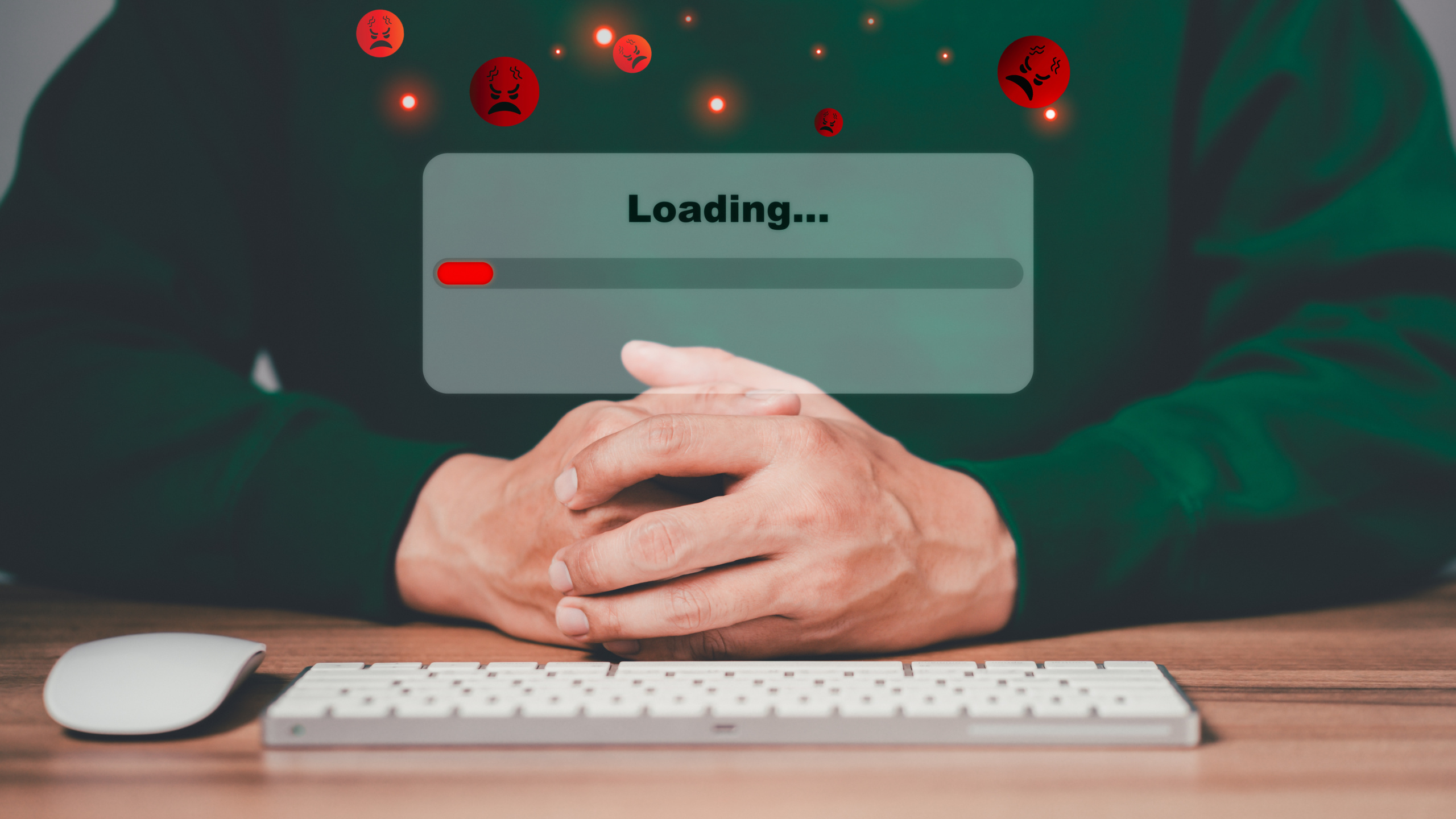 Man using a computer keyboard to download and waiting to loading